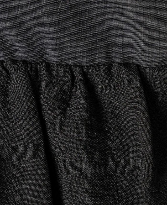 ティアードトップス/ripplesの生地アップ画像。細かく凸凹したさざ波のような柄。