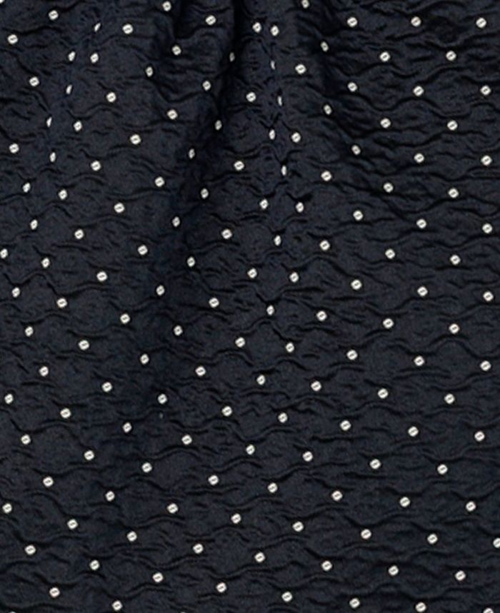 TRECODEのジャガード生地が上品さをプラスしてくれるドット柄のフリルバッグ。